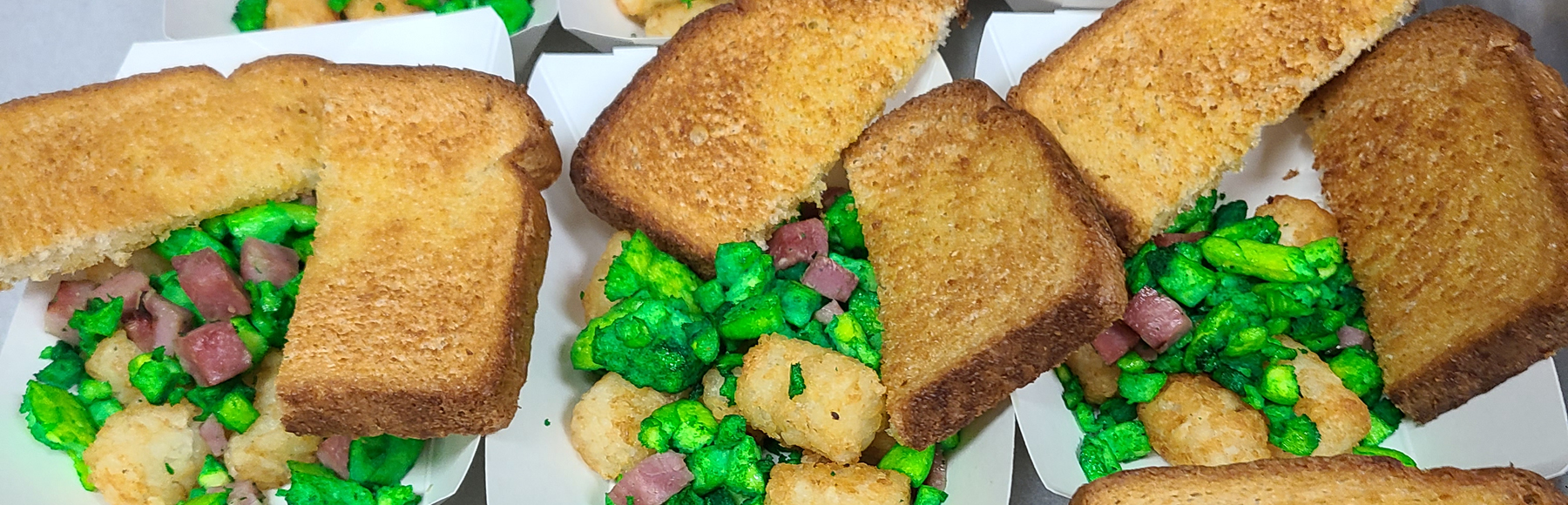 Elementary students celebrate reading on Dr. Seuss' birthday with lunch of green eggs and ham!