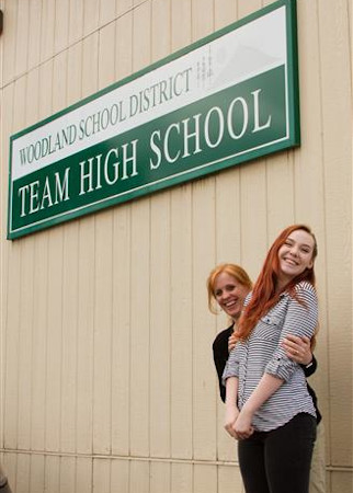 Photo: Team High sign with staff and student