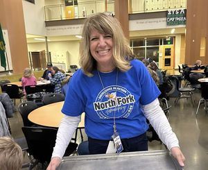North Fork Elementary Principal, Denise Pearl, smiling and holding a tray
