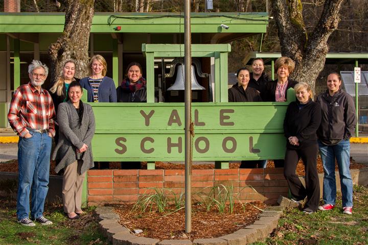 Photo: Yale Elementary School staff around Yale school sign
