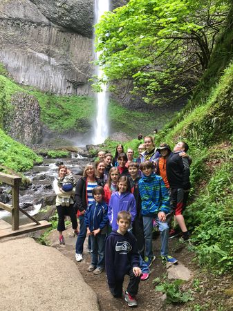 Family in front of a waterfall