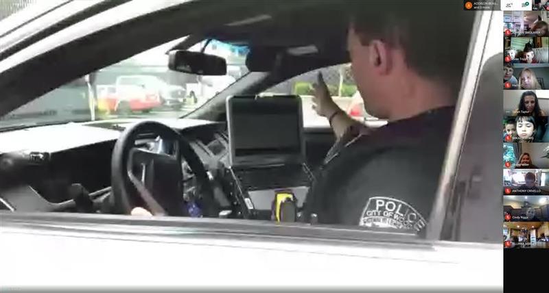 Officer Eric gave students a tour of police cruiser and showed them all the equipment he uses
