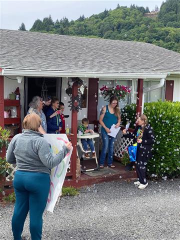 Staff members made posters, blew bubbles, and cheered on their preschool graduates.