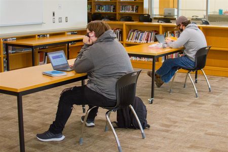 Working from the high school's library, students have access to high-speed internet and help from staff members, if needed.