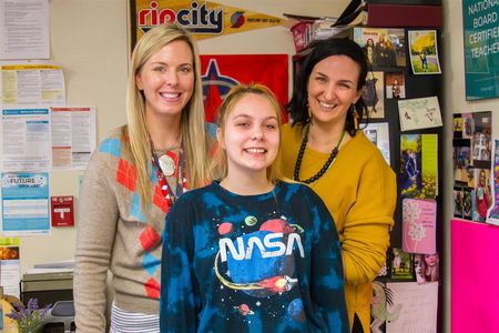 TEAM teachers Jill Domingo (left) and Liz Vallaire (right) seen here with 2019 graduate Chelsea Larson (Note: photo taken pre-pandemic)