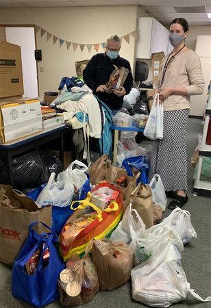 Gabrielle "Gabby" Meador (right) credits the Landrigans with the success of the food drive thanks to their dedication and hard work.