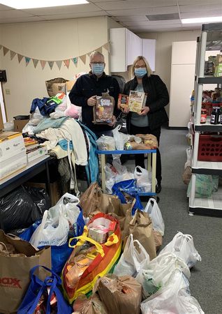 Elizabeth "Liz" and Scott Landrigan organized a neighborhood- and community-wide food drive to help provide food for students and families in need.