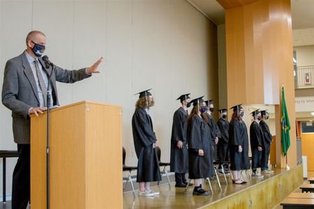 Woodland High School's Assistant Principal Dan Uhlenkott stepped in to deliver the commencement address and introduce graduates