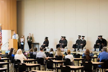 Superintendent Michael Green handed each graduate their diploma and gave them an elbow bump in lieu of a handshake