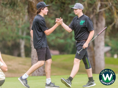 Two golf players shaking hands