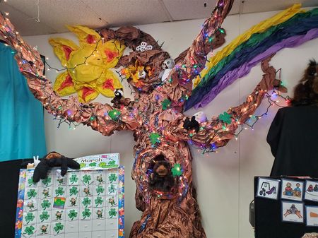 Patty Morgan uses a floor-to-ceiling paper mache tree which changes with each season along with a huge variety of stuffed animal puppets to help teach lesson