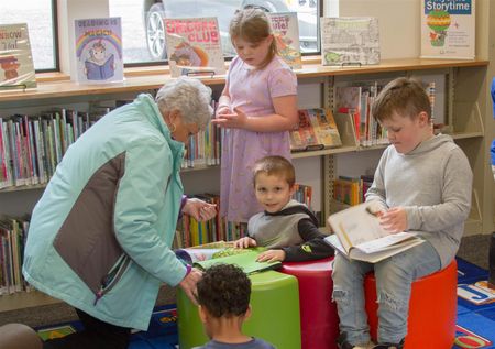 Yale students visit the library to learn about research resources, check out books, and more