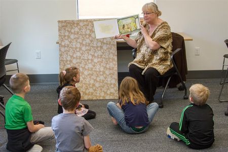 Yale kindergartners listen to a librarian read aloud