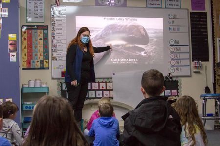 Field Educator Kelly McKenzie taught Woodland's elementary students about Pacific Gray Whales