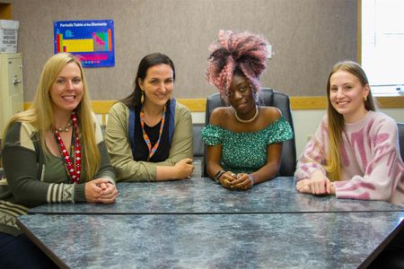 Grace Riesterer, second from right, graduated in two years at age 16, and Kylie Fredricks, far right, graduated with an Associate Degree from Clark College, too.