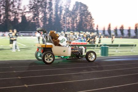 CTE Teacher Wayne Miller drove the Beaver mascot around in a classic roadster built and maintained by students taking auto mechanics classes