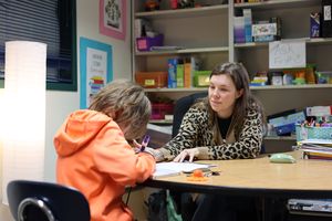 Image: Paraeducator assisting a student