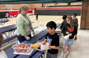 Image: Students getting a snack at Woodland Child Care