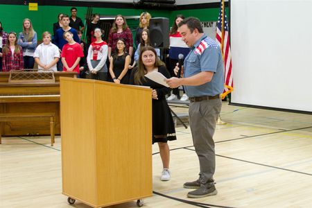 Abigail initially thought Dr. Russell Evans was recognizing her for her solo in one of the songs performed during the assembly