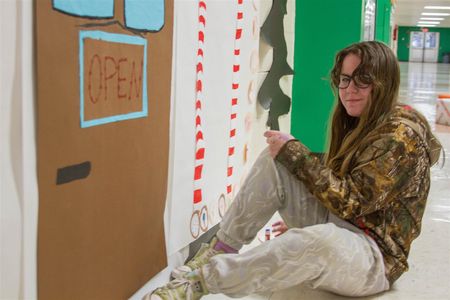 Alexea Lansing, seen her helping create the hallway winter wonderland, particularly enjoys graphic design
