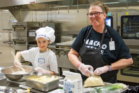 Lilli Tapani, a 4th grader, cooked her Cheesy Potatoes for the judges