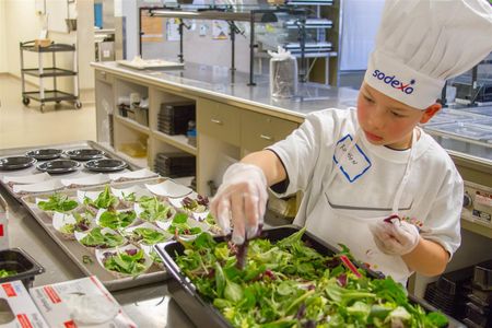 Ruxson Guajardo, a 4th grader, prepares his winning recipe - Blackberry, Bacon & Blue Cheese Salad