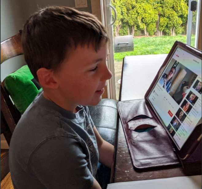 Carter watches an instructional video on his computer