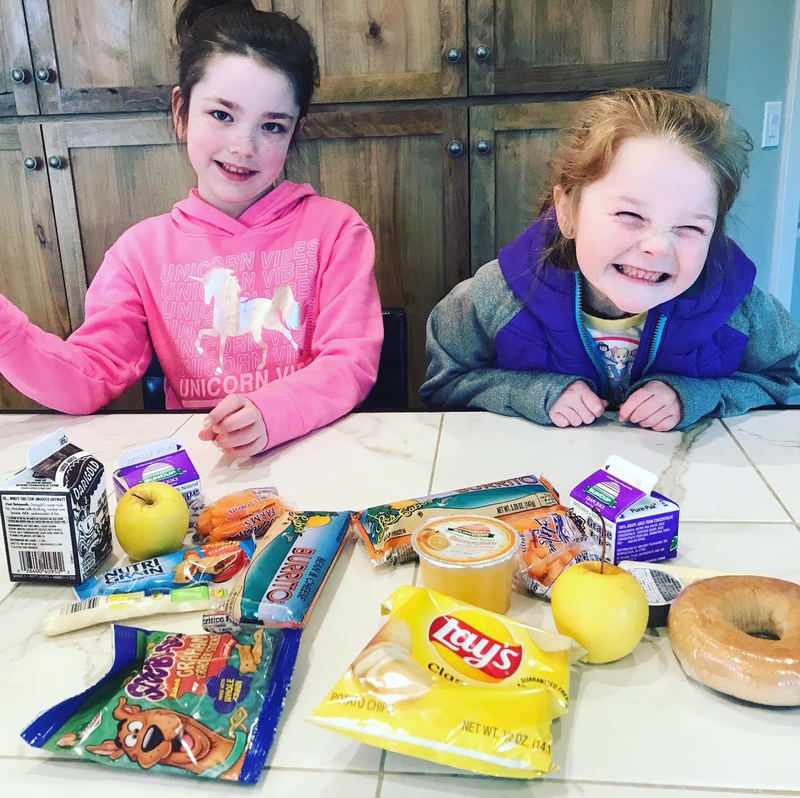 Scarlett and Piper making meals