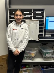 Student in front of shelving