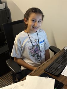 Student at a desk in Biz town