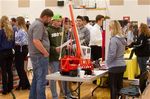 Student inspects device at CTE job fair